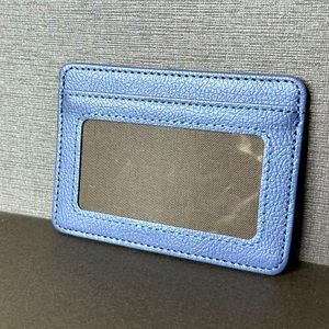NWOT: unisex, RFID blocking ID/ card holder, in blue. Offers accepted.